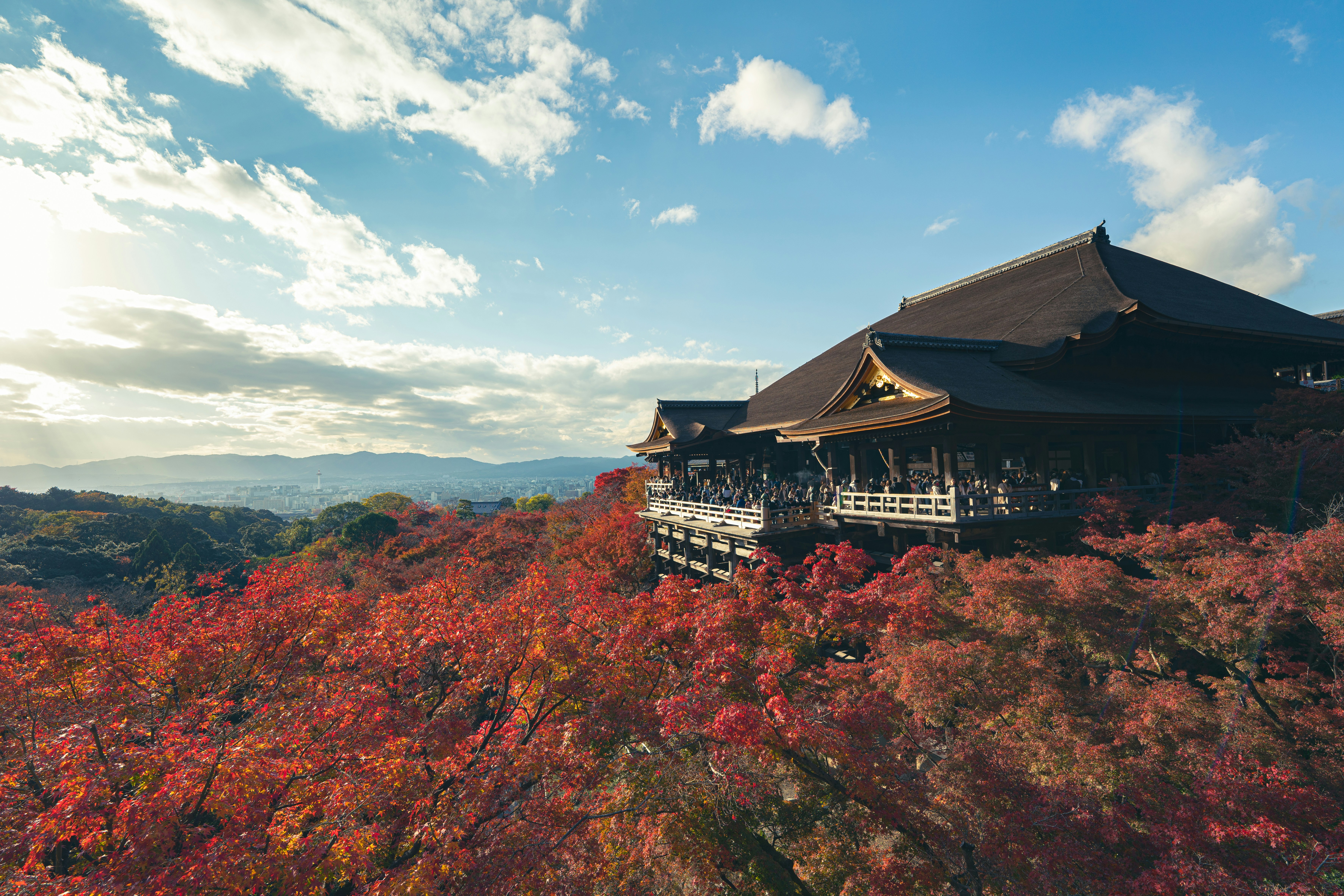 The wooden stage of Kiyomizu-dera temple overlooking forested hills